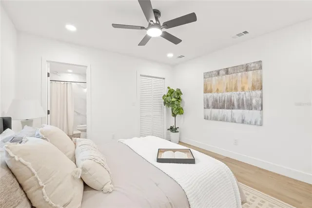 a bedroom with a bed and a couch