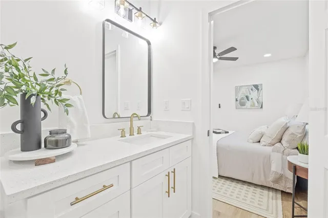 a bathroom with a sink and a mirror