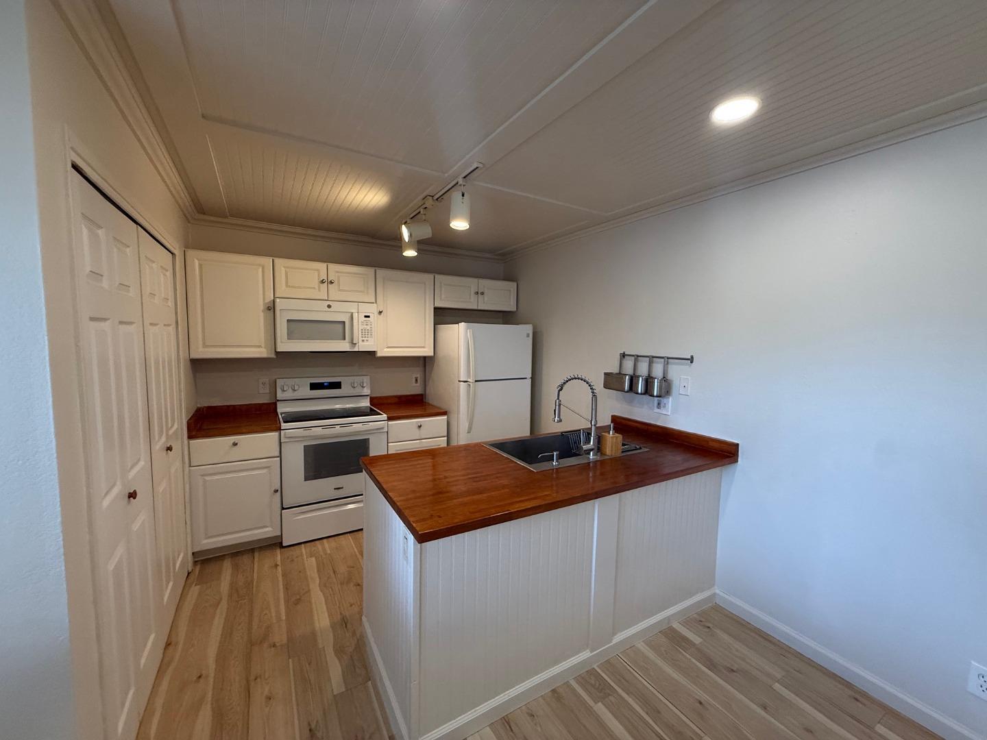 2505 Prescott Road, Unit 1 Modesto, CA 95350 - Photo 20 of 42 a kitchen with granite countertop a sink stove and refrigerator