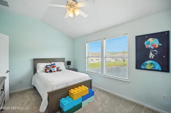 a bedroom with furniture and a bed