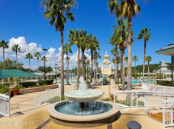 a view of a swimming pool with a table and chairs