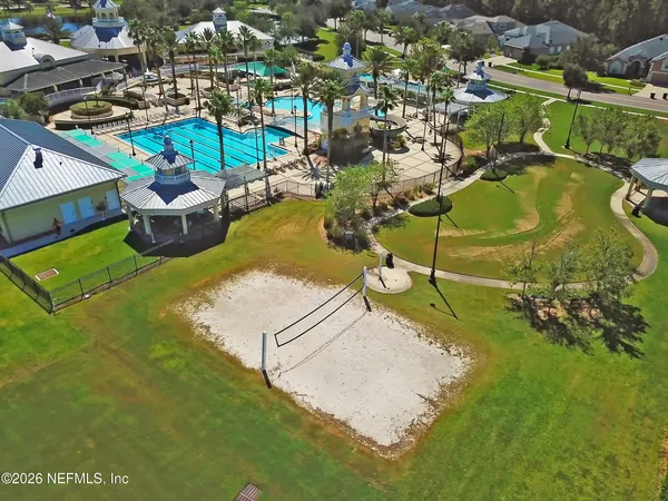 an aerial view of a house with a ocean view