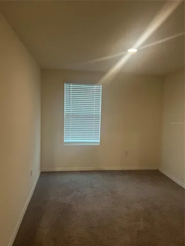an empty room with a empty space and window