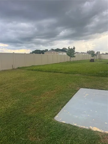 a view of an ocean and a yard