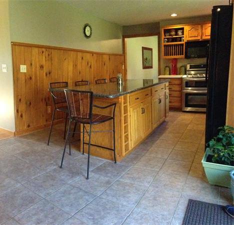 213 Hathaway Road Acushnet, MA 02743 - Photo 7 of 18 a kitchen with stainless steel appliances granite countertop a stove a sink and a refrigerator
