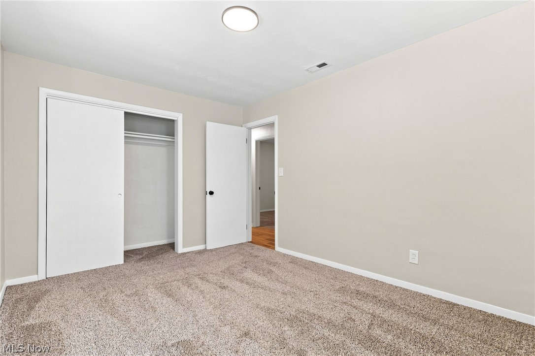 7524 Root Road North Ridgeville, OH 44039 - Photo 31 of 50 Neutral-toned walls complement the carpeted flooring