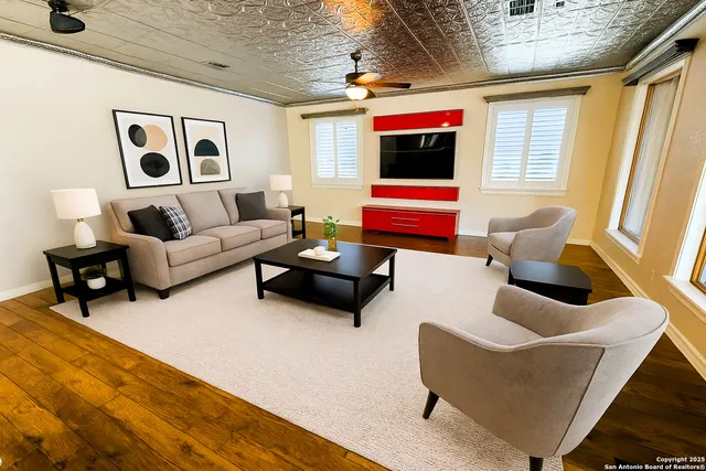 a dining room with furniture and wooden floor