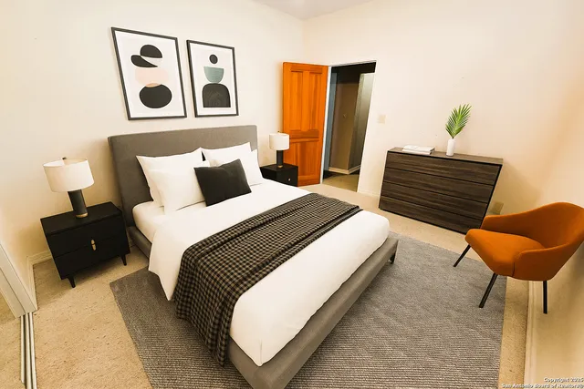 a bedroom with a bed and a television