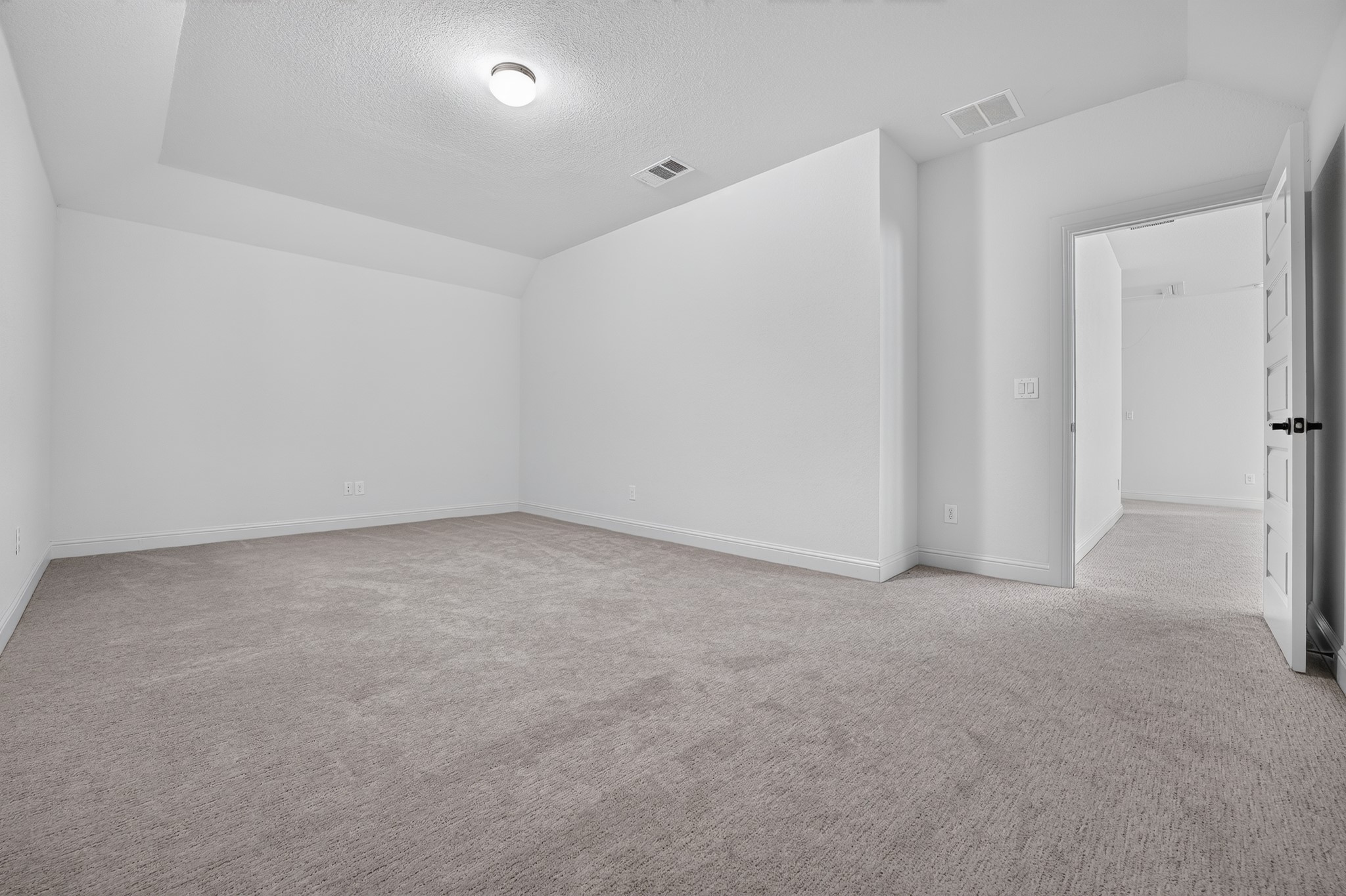 508 Pinnacle View Drive Georgetown, TX 78628 - Photo 11 of 27 A spacious, naturally illuminated room featuring a tray ceiling and soft carpeting, perfect for quiet enjoyment.