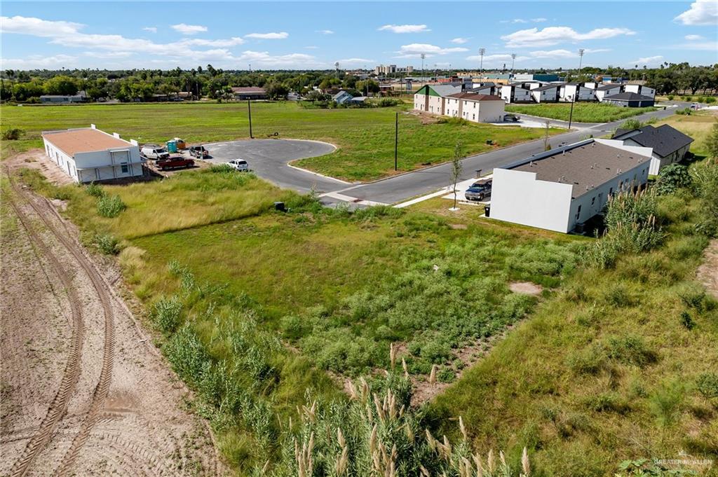 Lot 11 Larkview Street Weslaco, TX 78596 - Photo 6 of 6 an aerial view of a house with a garden and lake view