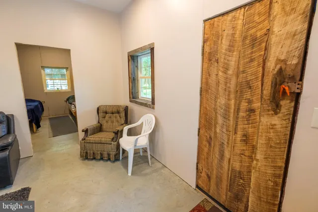 a living room with a couch and a window