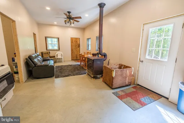 a dining room with furniture and a fireplace