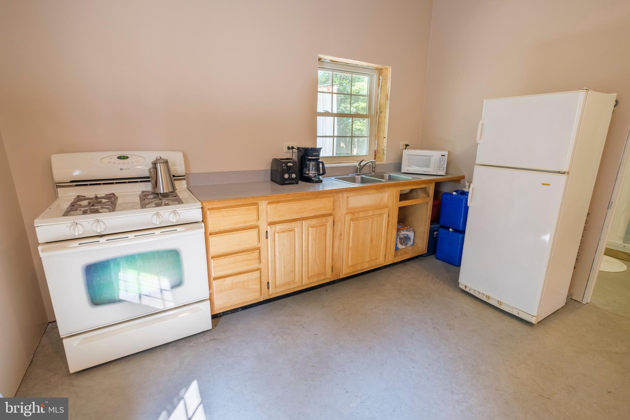 848 Sugar Camp Road Clearfield, PA 16830 - Photo 25 of 54 a kitchen with a stove top oven and a refrigerator
