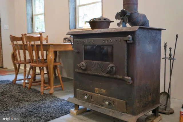 a bed room with a bed and a chair