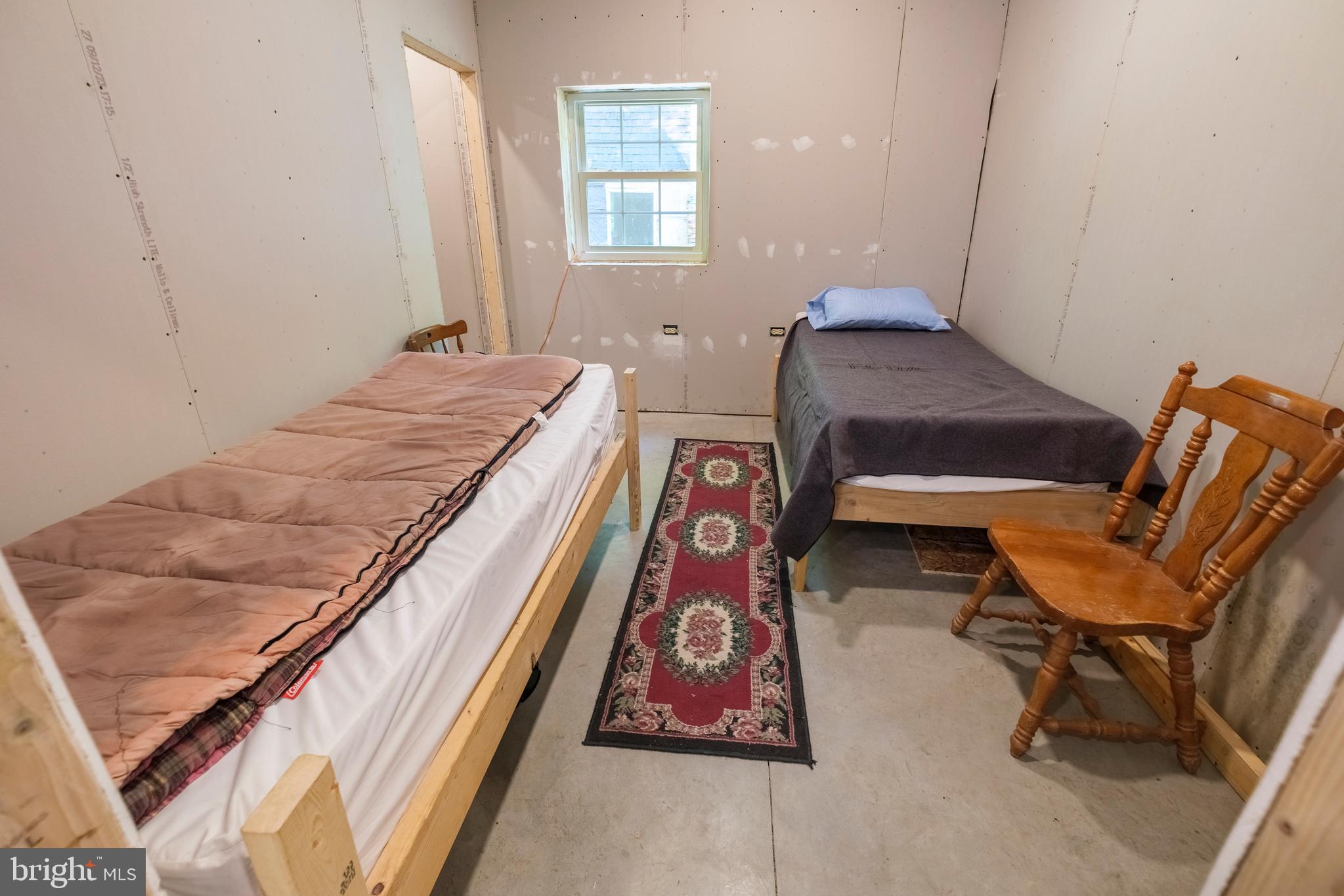 848 Sugar Camp Road Clearfield, PA 16830 - Photo 28 of 54 a bed room with a bed and a chair