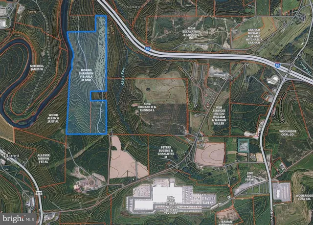 an aerial view of a residential houses with outdoor space