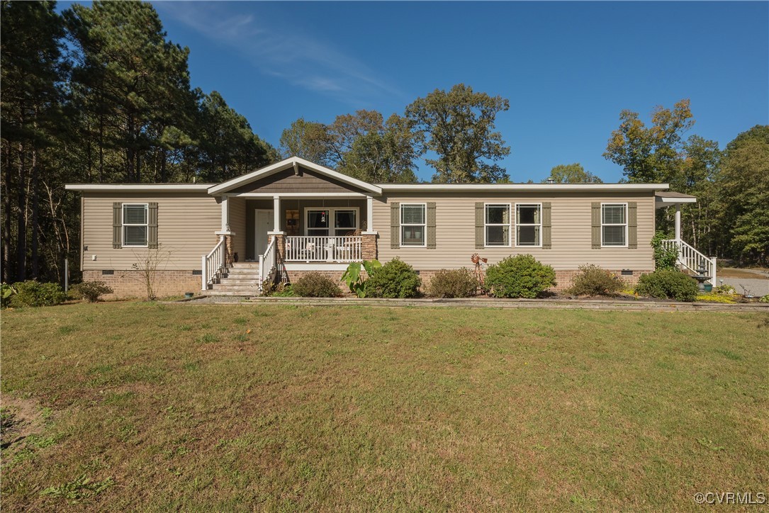 566 Cheaneys Bridge Road Dunnsville, VA 22454 - Photo 1 of 50 View of front of house featuring a front yard and