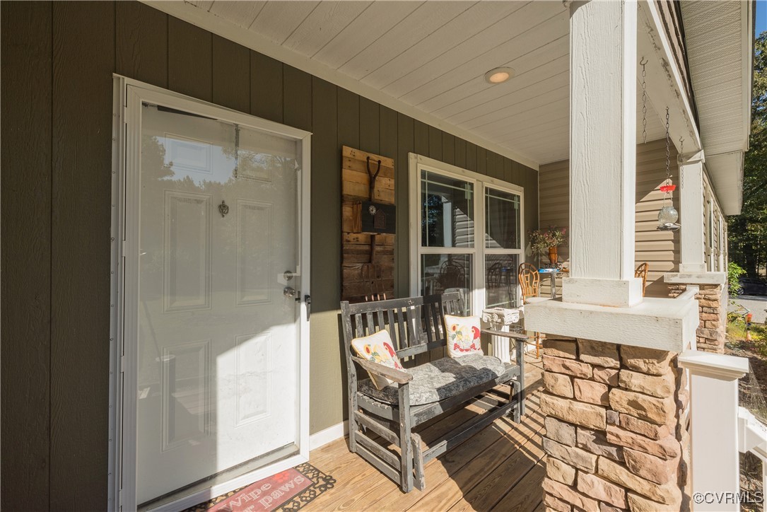 566 Cheaneys Bridge Road Dunnsville, VA 22454 - Photo 2 of 50 View of exterior entry with a porch