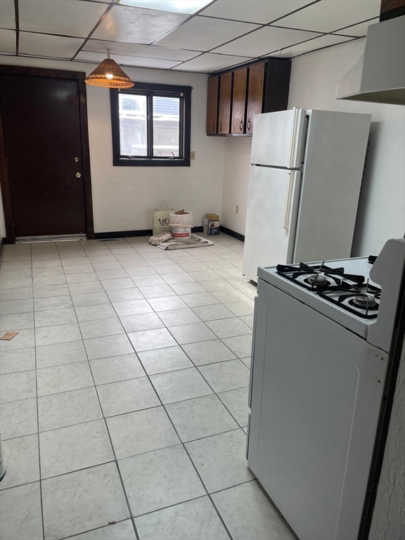 230 Pearl Street, Unit 1 Somerville, MA 02145 - Photo 4 of 11 a view of kitchen with washer and dryer