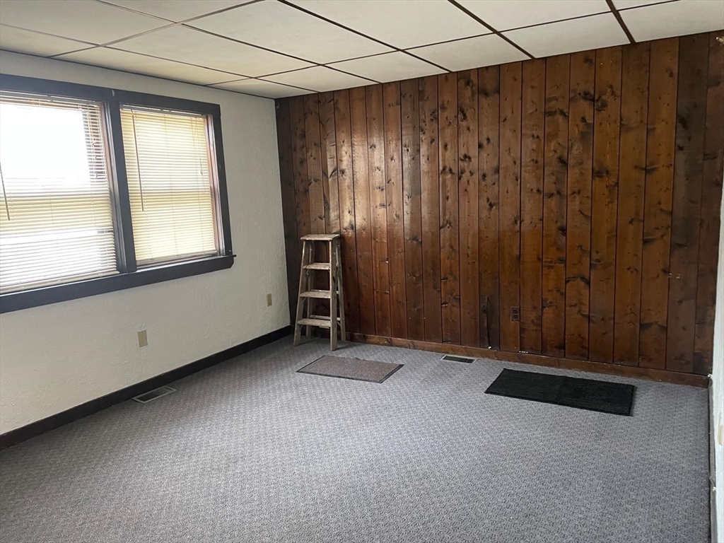 230 Pearl Street, Unit 1 Somerville, MA 02145 - Photo 6 of 11 an empty room with windows