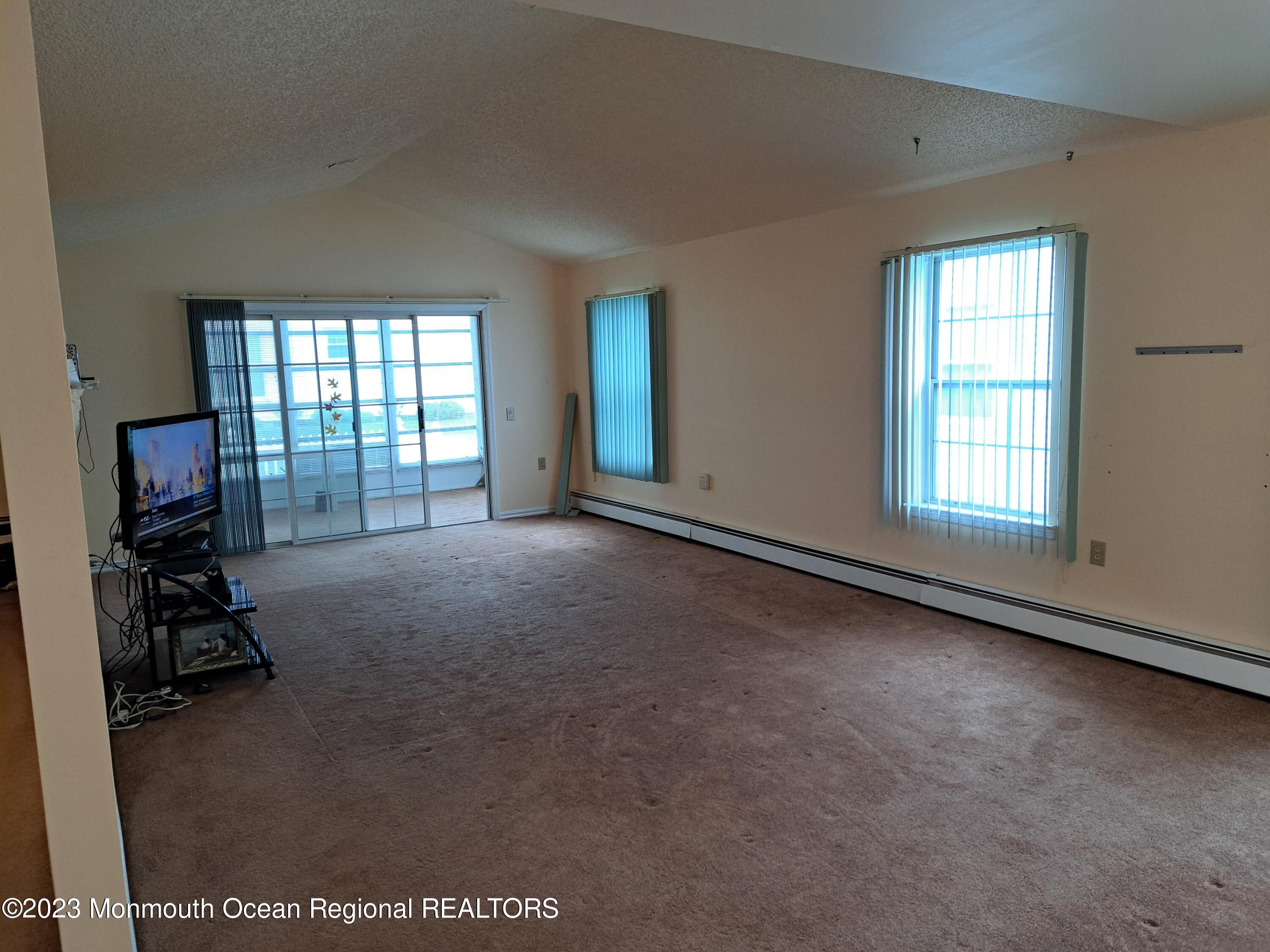 48 Narberth Way Toms River, NJ 08757 - Photo 9 of 12 living room with sliding door 48 Narbert