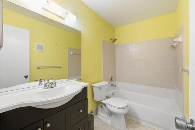 a bathroom with a sink a toilet and a bathtub