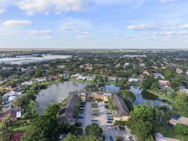 an aerial view of a city with mountains
