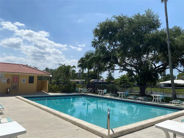 a view of a swimming pool with a patio