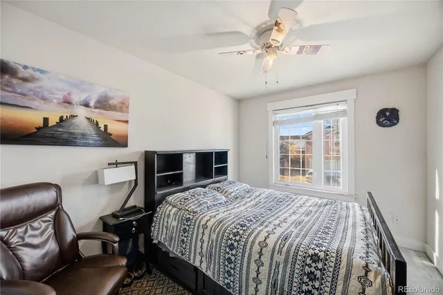 a view of a workspace with furniture and a flat screen tv