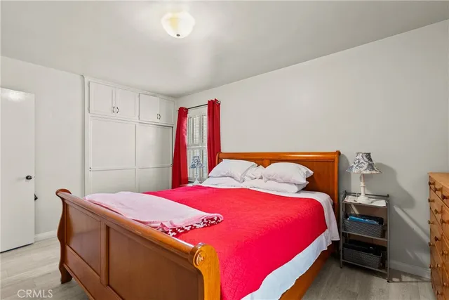 a bedroom with a bed and a closet