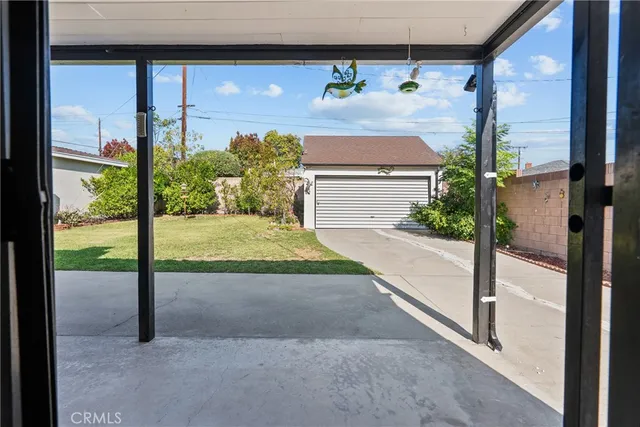 a view of a room with a floor to ceiling window and wooden floor