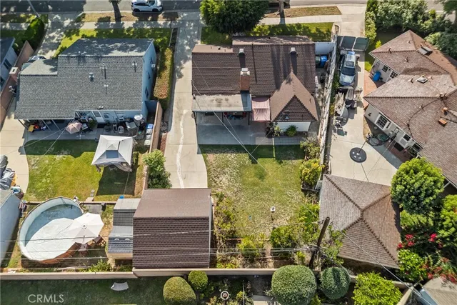 an aerial view of houses with yard