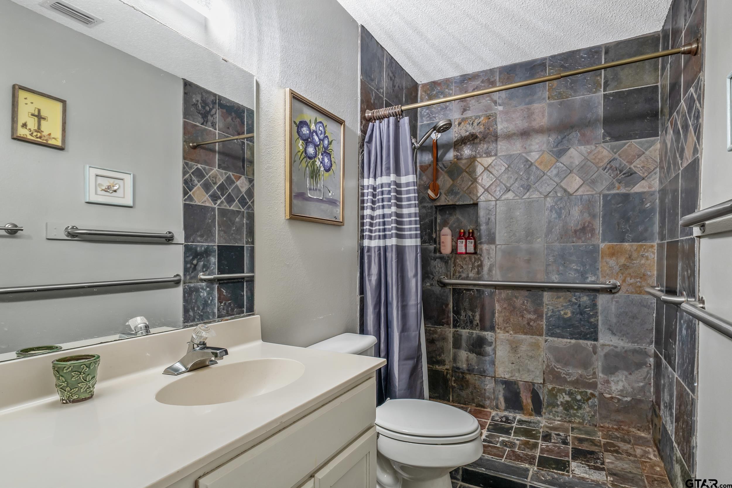 201 Elmwood Lane Holly Lake Ranch, TX 75765 - Photo 12 of 34 a bathroom with a sink toilet and shower
