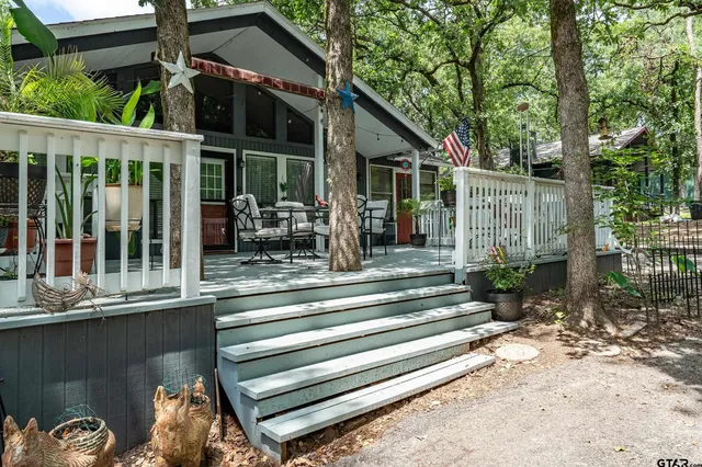 a view of a chair and tables in patio of the house
