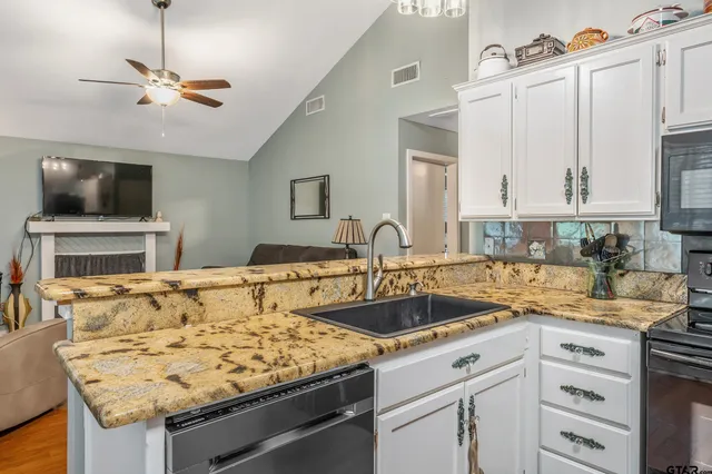 a kitchen with a stove and a sink
