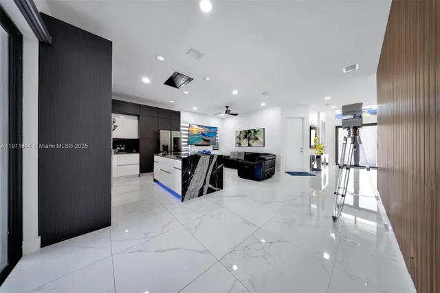 a kitchen with stainless steel appliances a stove sink microwave and cabinets