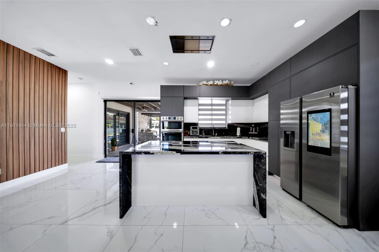 1550 Southwest 89th Court Miami, FL 33174 - Photo 21 of 67 a kitchen with stainless steel appliances granite countertop a sink stove and refrigerator