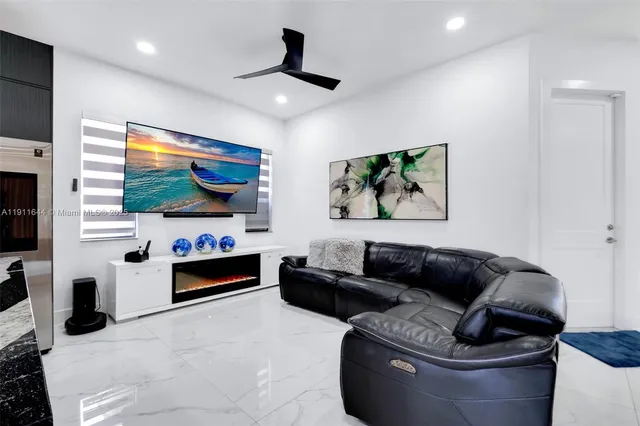 a bedroom with a bed and painting on the wall