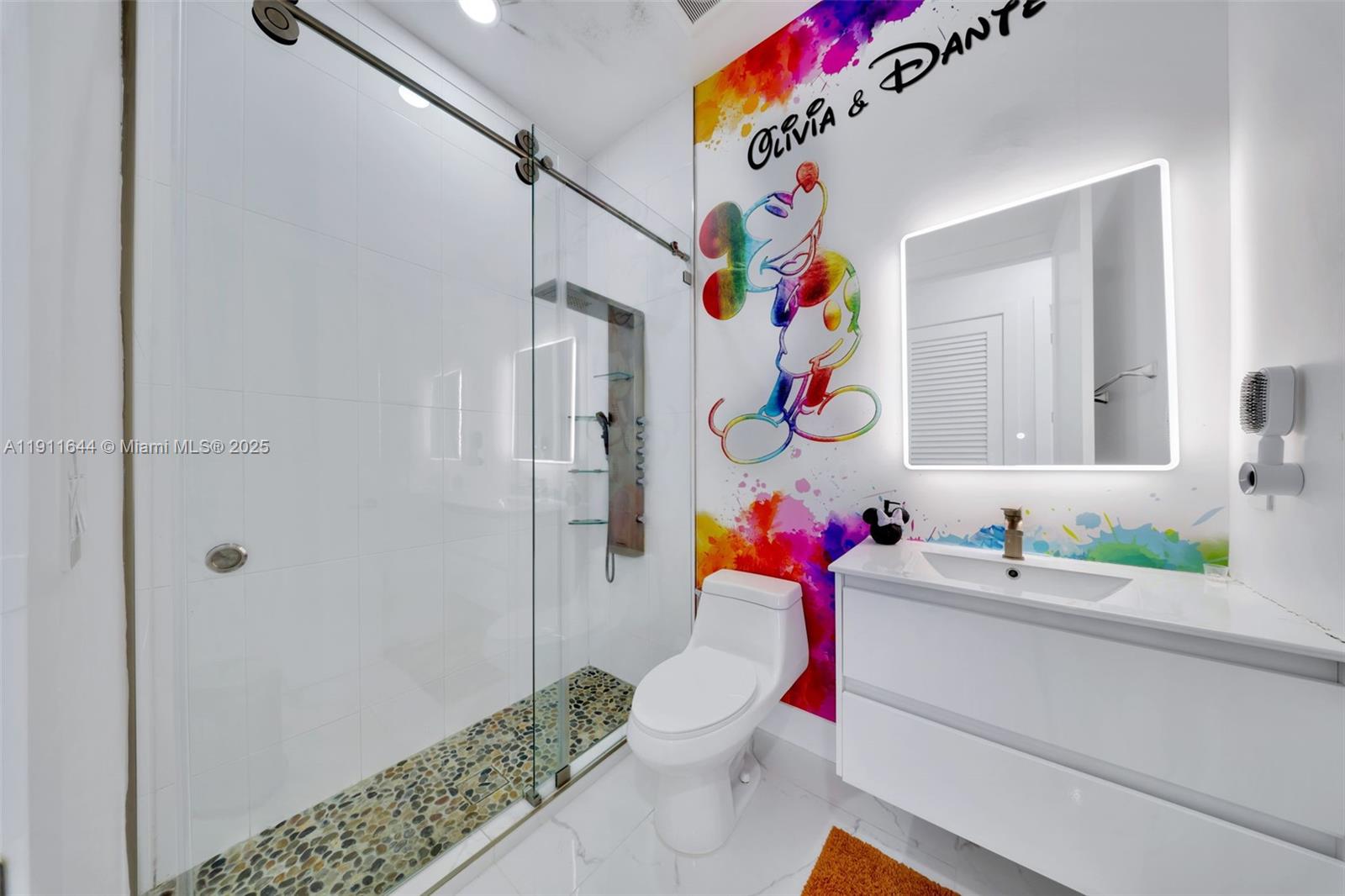 1550 Southwest 89th Court Miami, FL 33174 - Photo 28 of 67 a bathroom with a sink mirror vanity and toilet