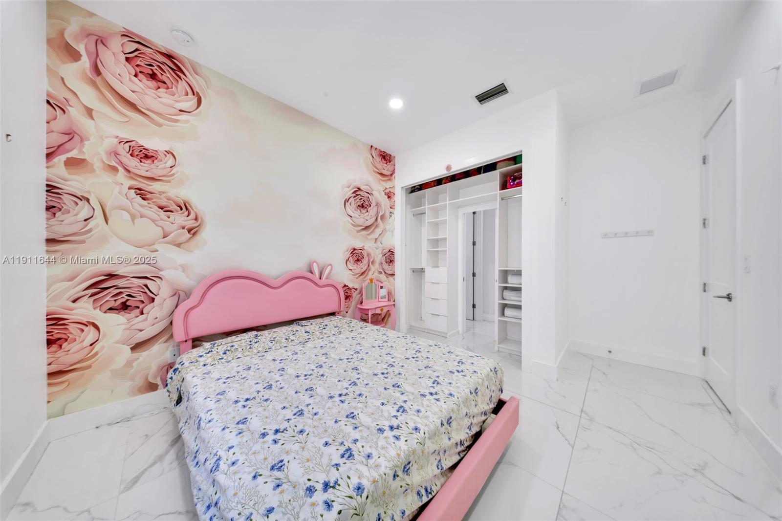 1550 Southwest 89th Court Miami, FL 33174 - Photo 31 of 67 a bedroom with a bed and a white painted wall