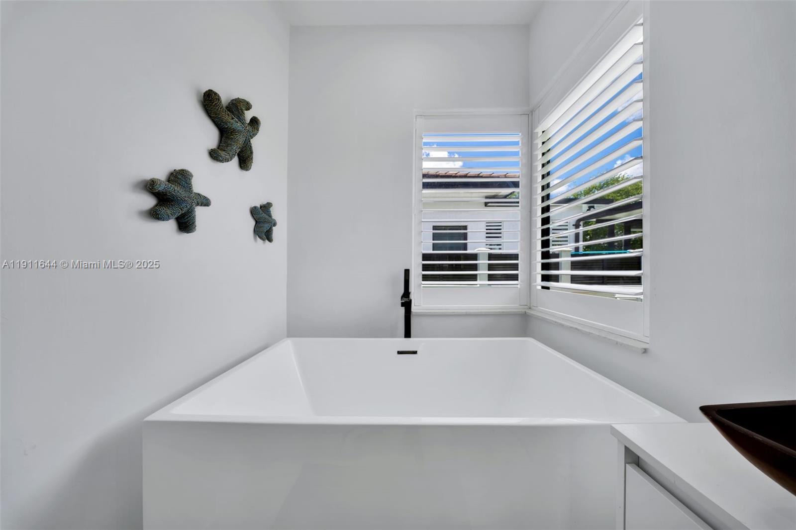 1550 Southwest 89th Court Miami, FL 33174 - Photo 39 of 67 a bathroom with a sink and a window