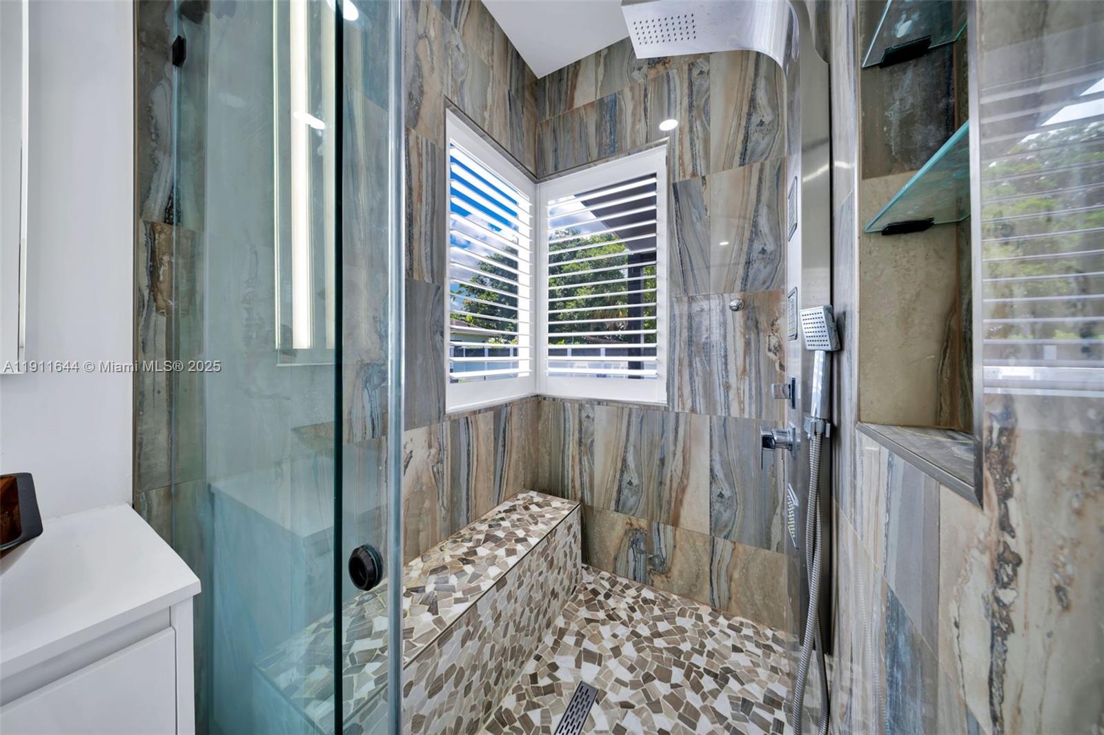 1550 Southwest 89th Court Miami, FL 33174 - Photo 40 of 67 a bathroom with a shower and a sink