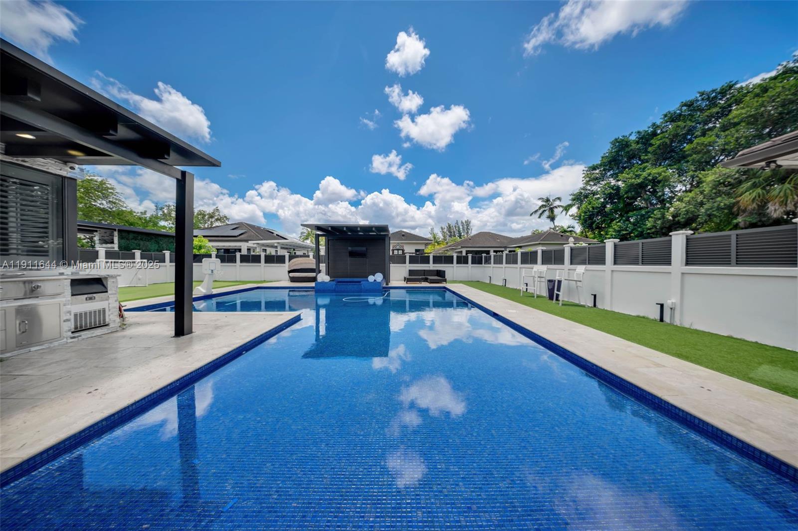 1550 Southwest 89th Court Miami, FL 33174 - Photo 45 of 67 a view of a swimming pool with seating space