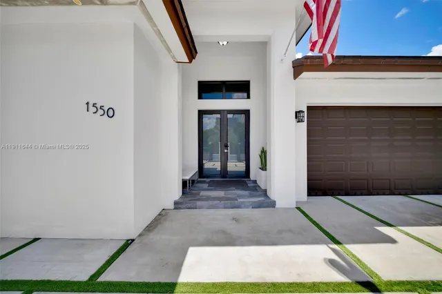 a reading room with furniture a rug and a window