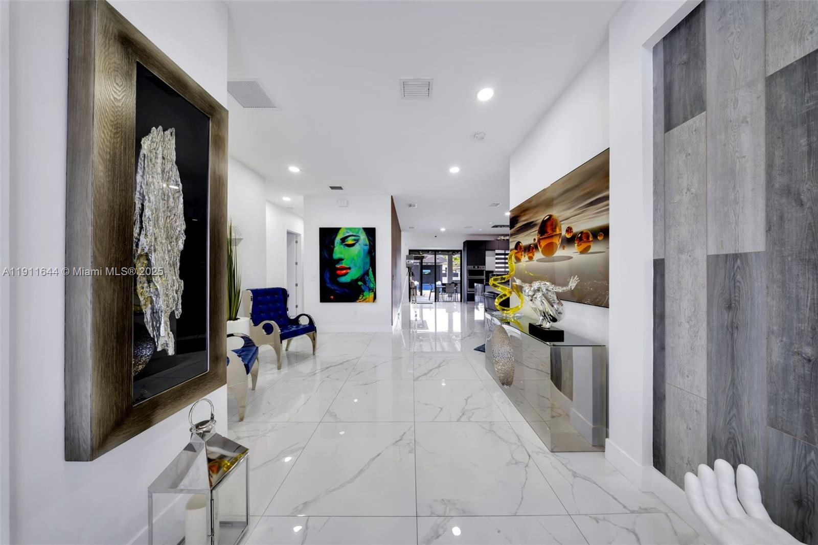 1550 Southwest 89th Court Miami, FL 33174 - Photo 10 of 67 a view of a hallway with dining room and glass windows