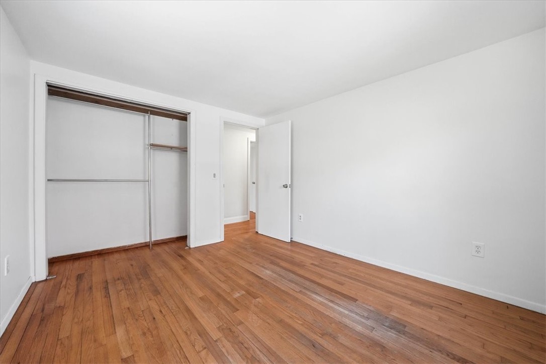 322 Rocky Hill Road Scituate, RI 02857 - Photo 36 of 50 Bedroom 2 at front of house, again with hardwoods and plenty of natural light. Freshly painted in a light-neutral color.
