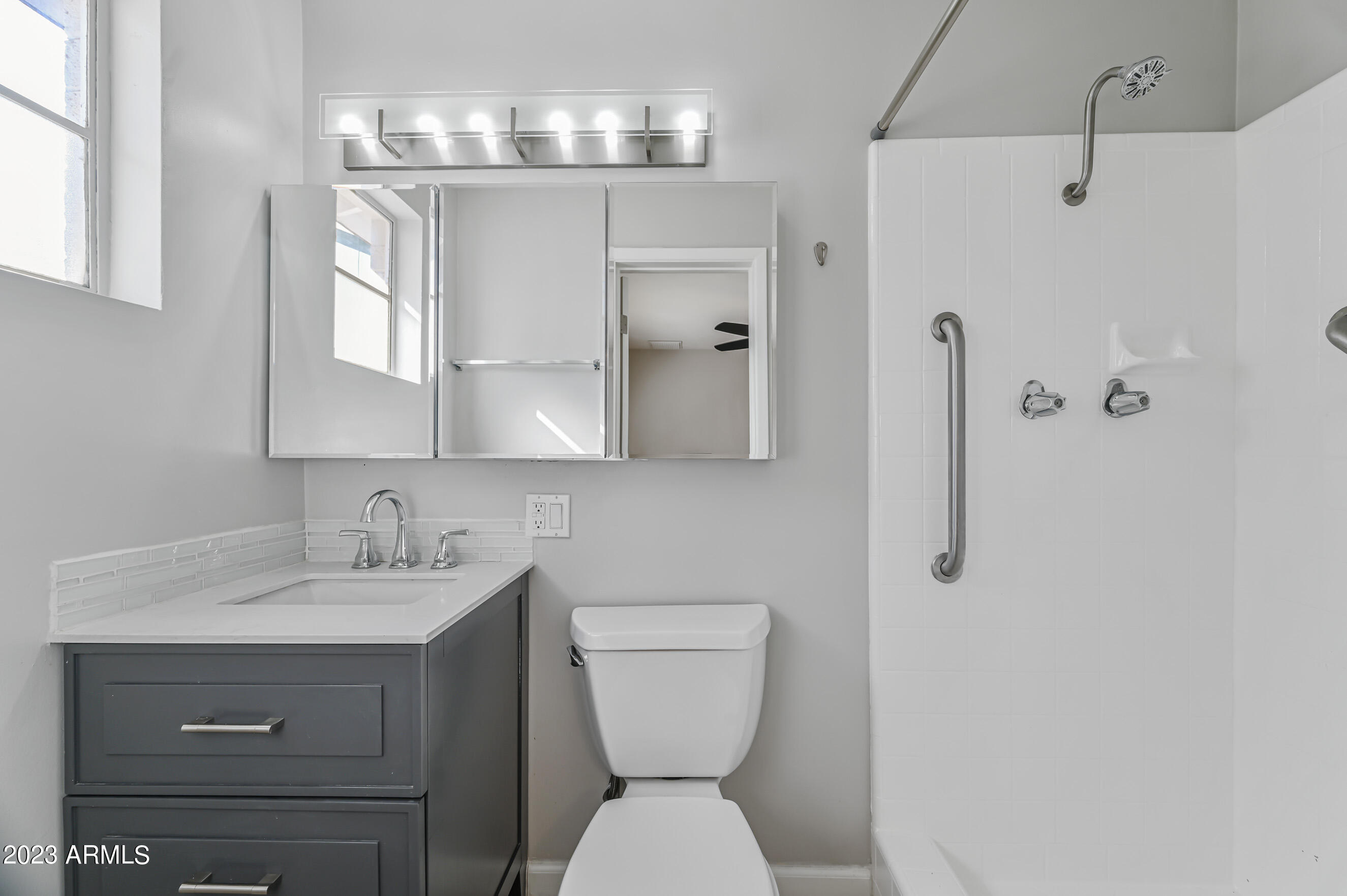 1227 East Las Palmaritas Drive Phoenix, AZ 85020 - Photo 15 of 22 a bathroom with a toilet sink and mirror