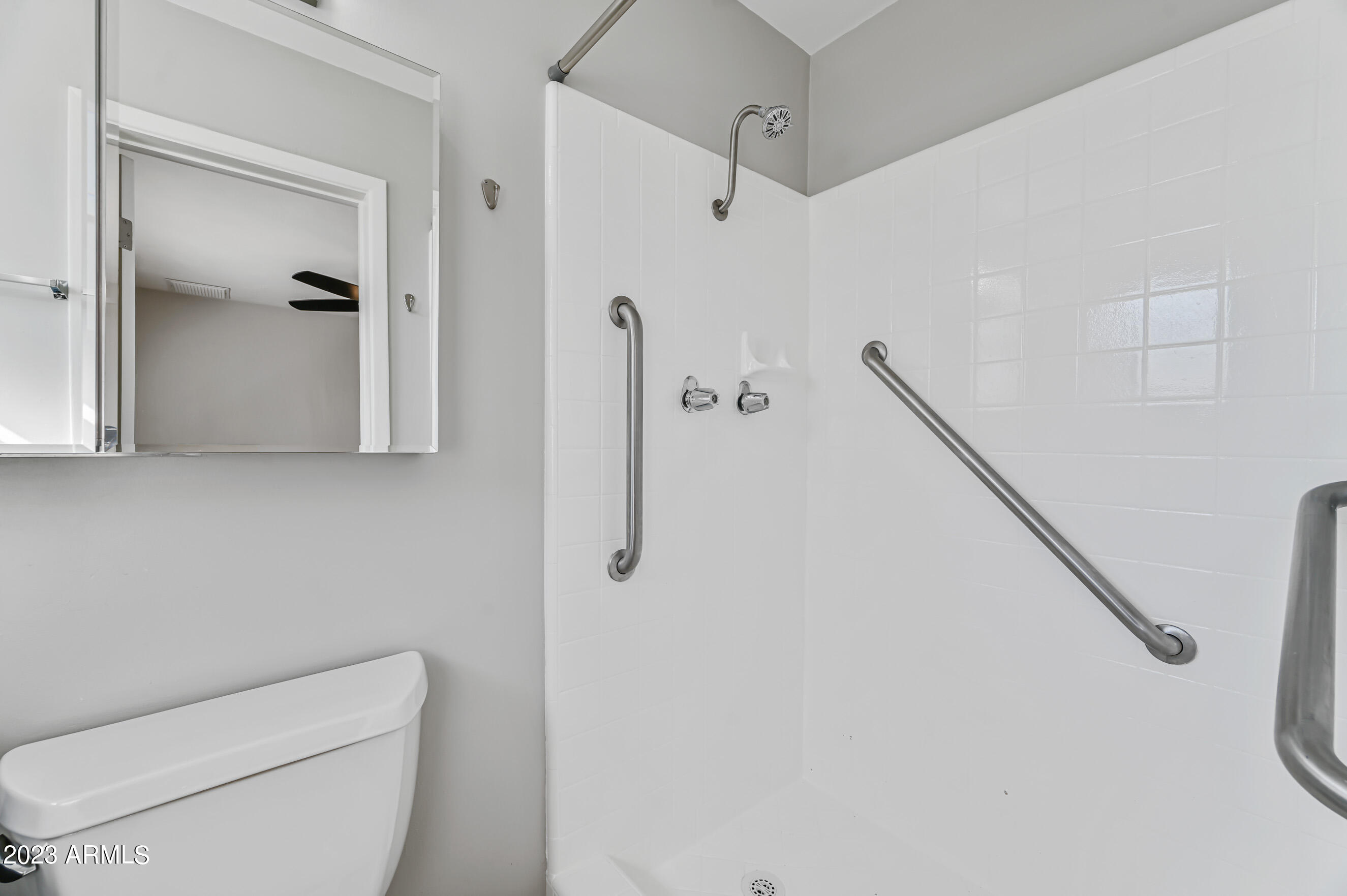 1227 East Las Palmaritas Drive Phoenix, AZ 85020 - Photo 16 of 22 a bathroom with a toilet and a shower