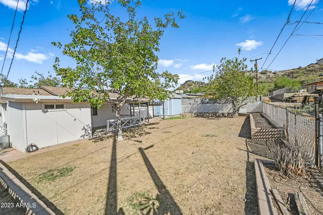 a view of a backyard and a patio