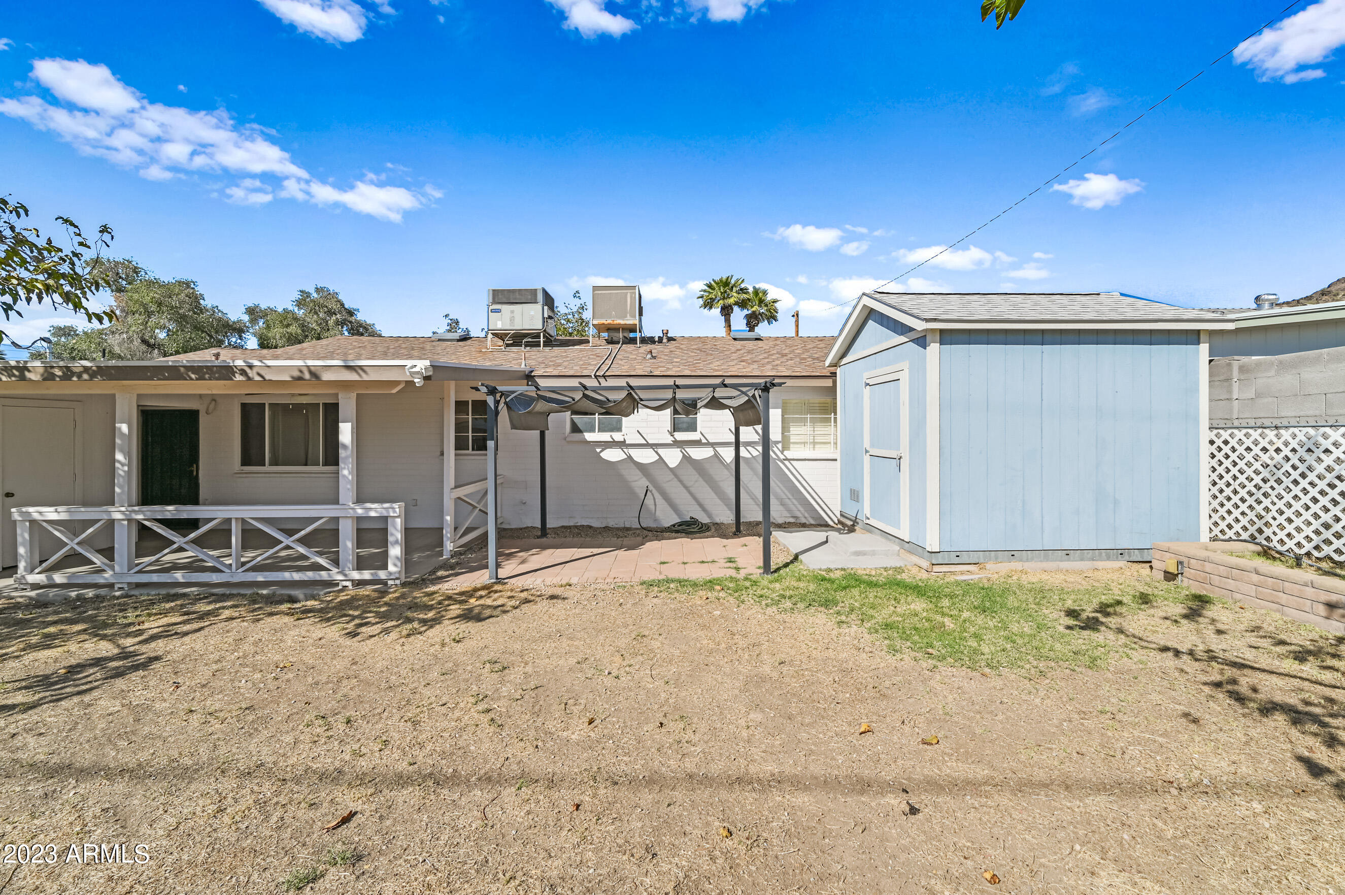 1227 East Las Palmaritas Drive Phoenix, AZ 85020 - Photo 22 of 22 a backyard of a house with table and chairs